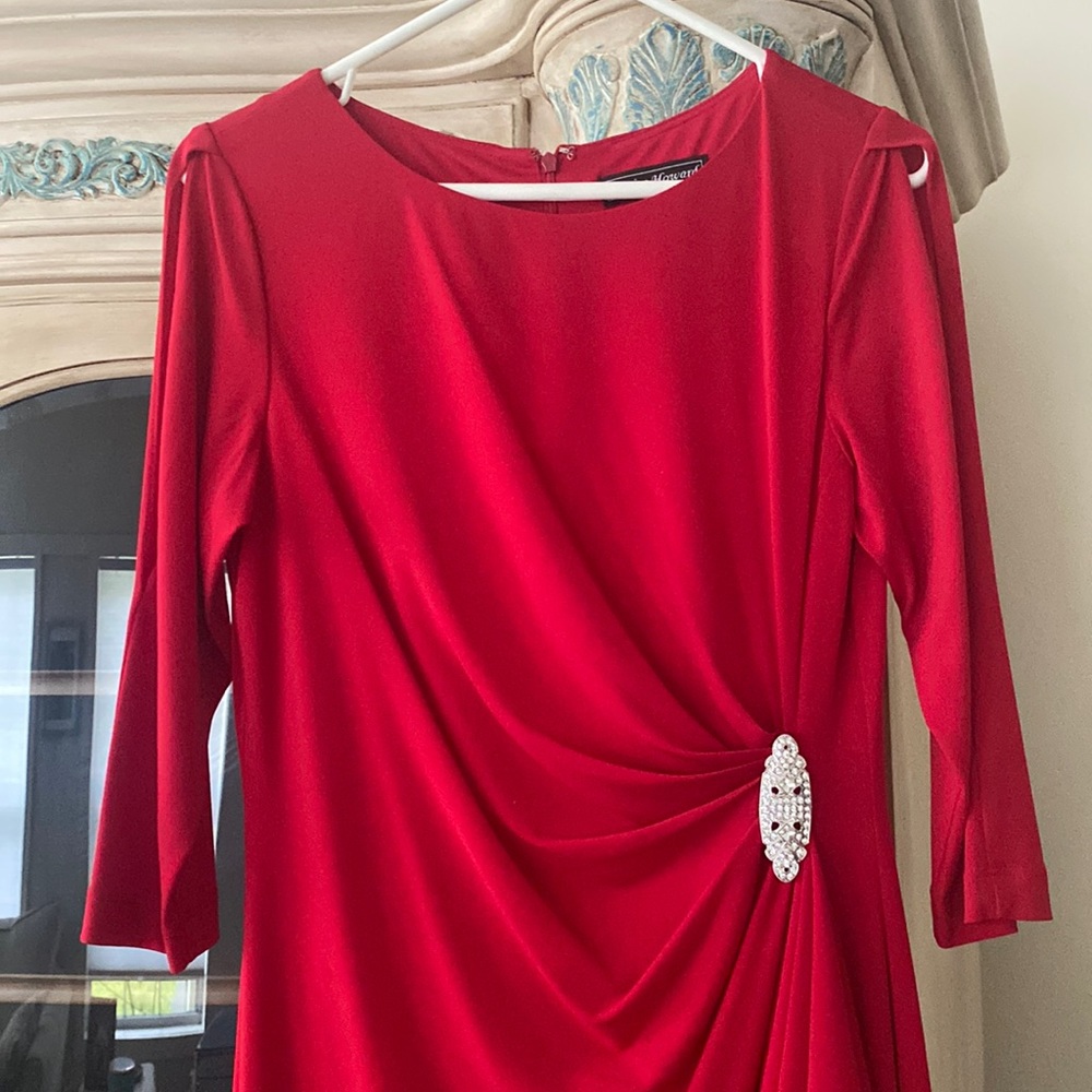 Beautiful fitted red mid length with open slits on the sleeves.